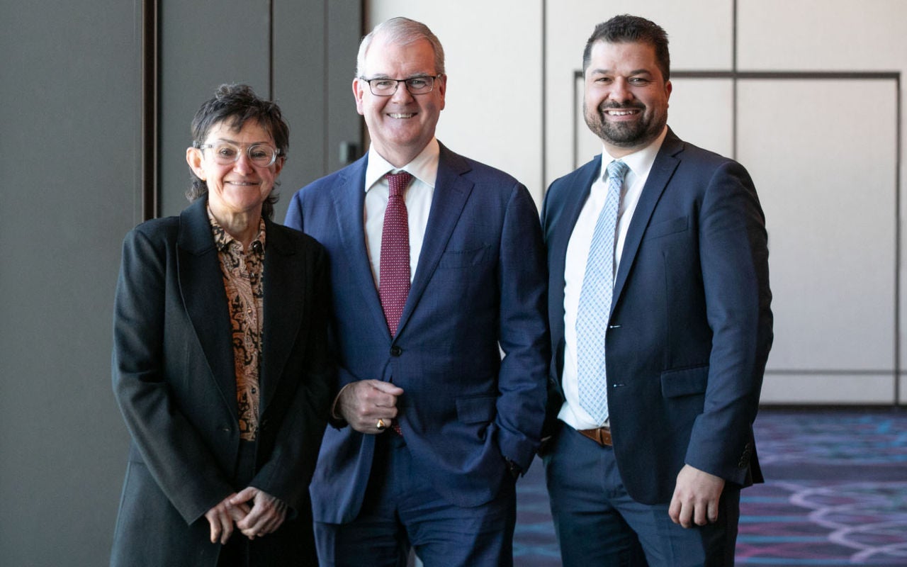 Photo of three people standing together, smiling. To the left is Monique Hitter, Legal Aid NSW CEO. In the middle is NSW Attorney General, Michael Daley, MP. To the right is Legal Aid NSW Executive Director Criminal Law, Robert Hoyles.