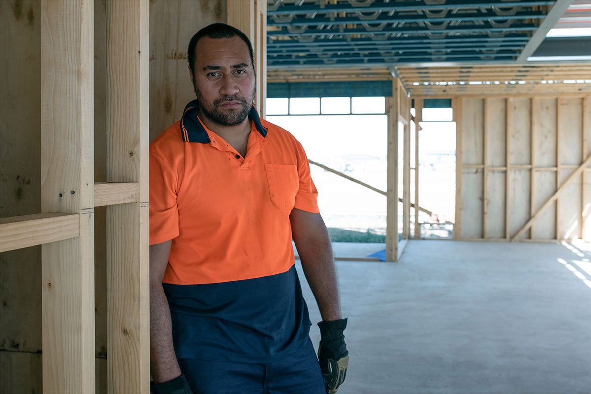 Construction worker in high vis shirt on a construction site