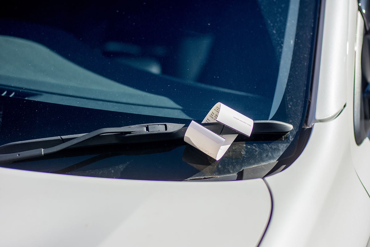 Ticket for illegal parking issued by australian parking ranger on a windscreen of a white car